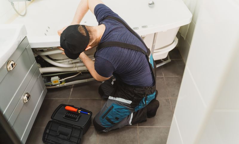 Licensed plumber inspecting plumbing